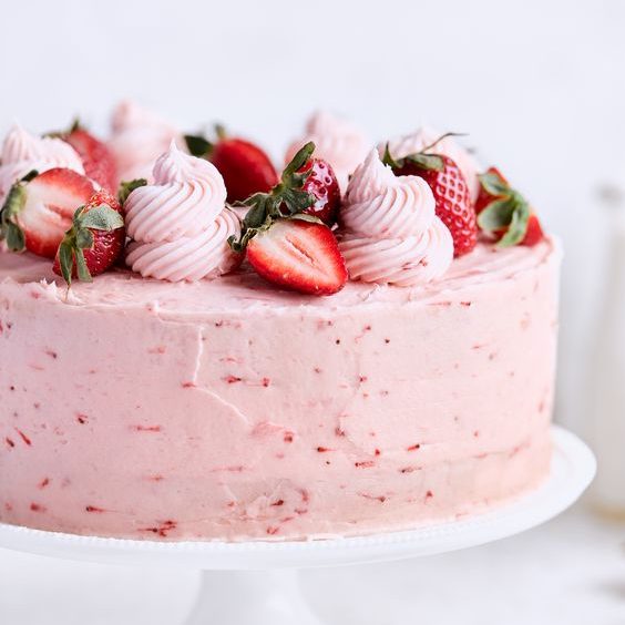 Strawberry cake with vanilla strawberry frosting.